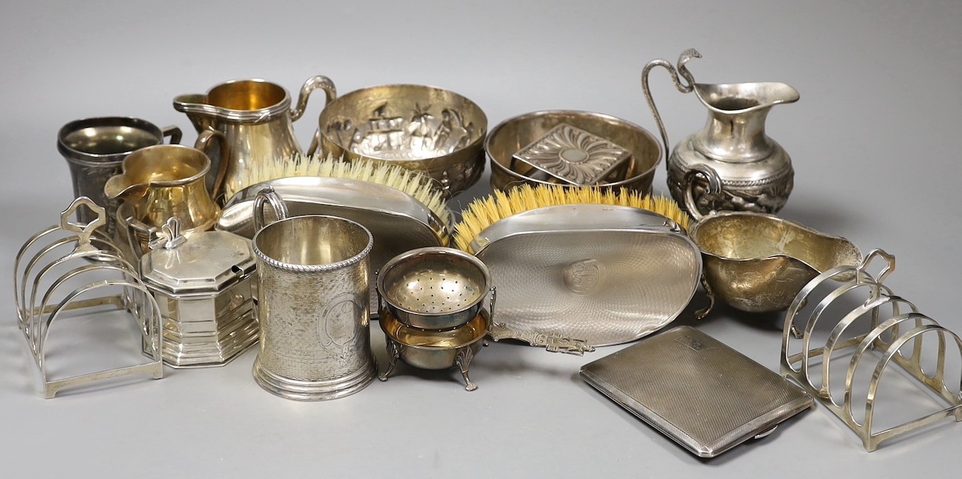 Mixed silver and white metal items including par of toastracks, sugar bowl match sleeve, sauceboat, cream jug, Victorian christening mug, pair of silver mounted clothes brushes, silver mustard silver cigarette case, 25.8